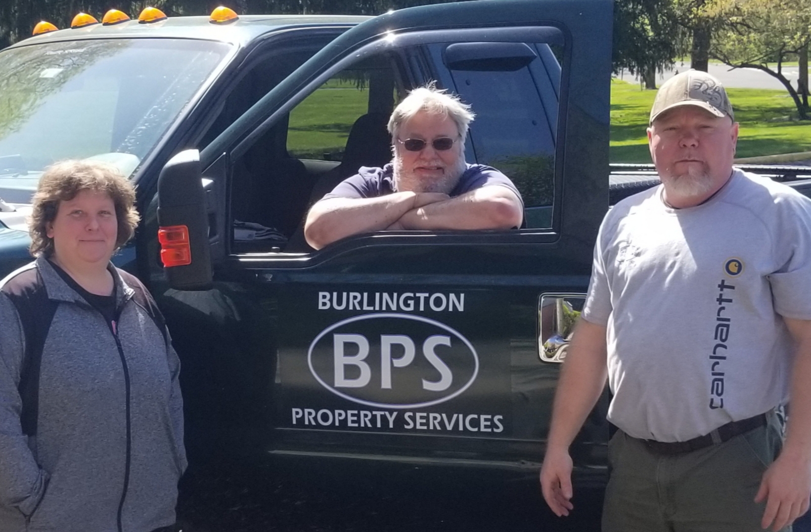 Management Team by a BPS truck